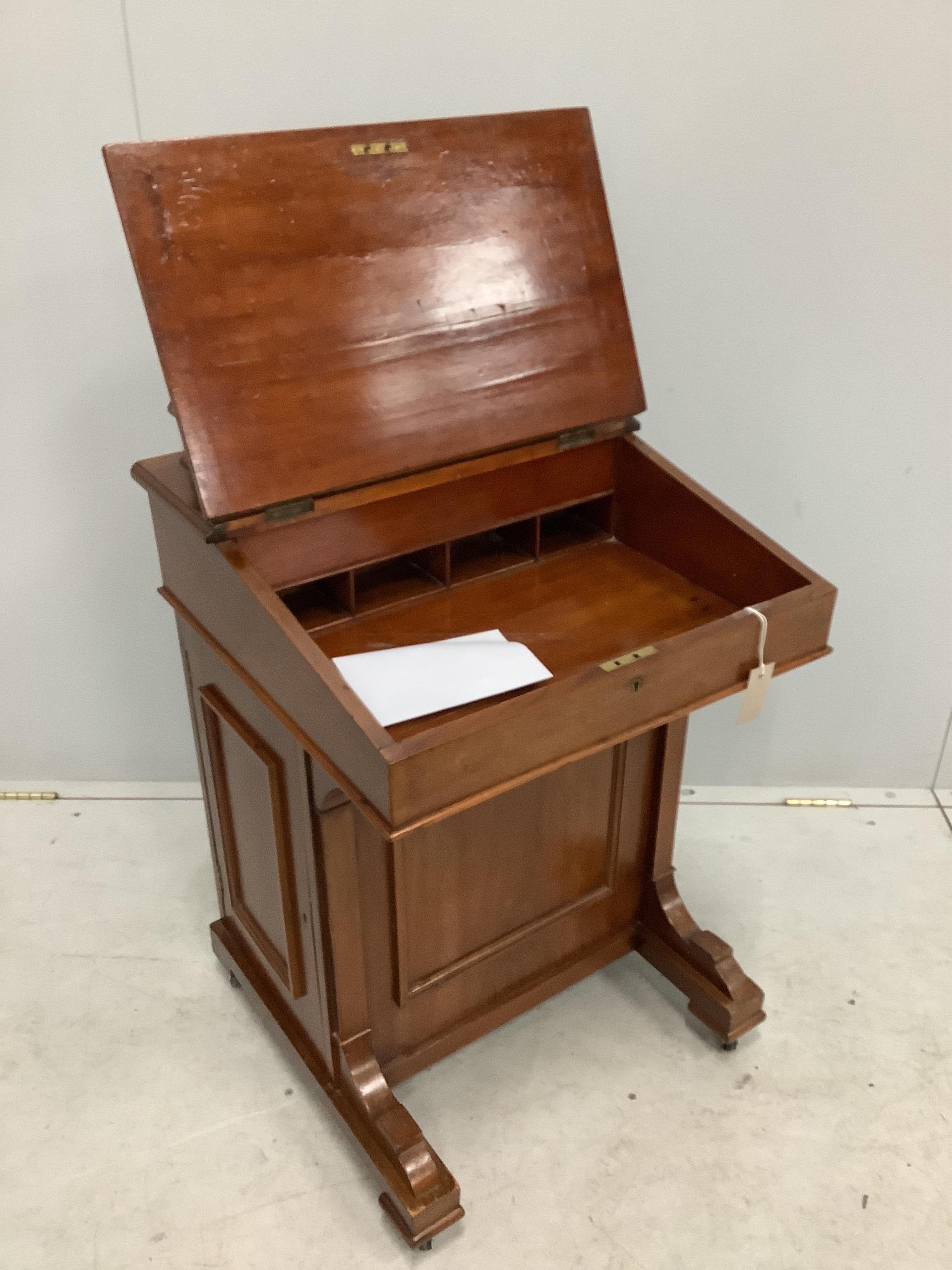 A late Victorian walnut Davenport, width 55cm, depth 53cm, height 87cm. Condition - fair